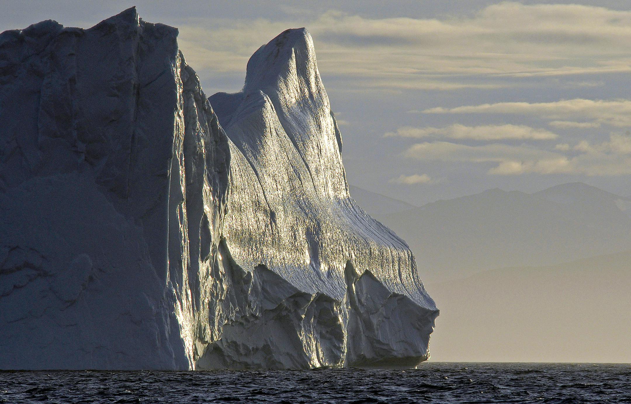 A massive iceberg greeted the crew of Ocean Watch as the exited the channels of the Northwest Passage and entered Baffin Bay, some 500 miles north of the Arctic Circle.