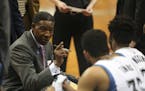 Timberwolves head coach Sam Mitchell made a point with Timberwolves center Karl-Anthony Towns (32) during a timeout in the second quarter Sunday after