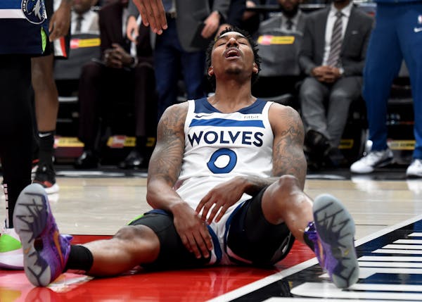 Minnesota Timberwolves guard Jeff Teague reacts to an official's call during the second half of the team's NBA basketball game against the Portland Tr