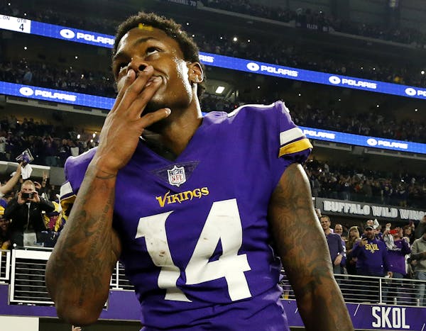 Vikings receiver Stefon Diggs (14) celebrated at the end of the game. Diggs scored a 61-yard touchdown to win the game. Minnesota beat New Orleans by 