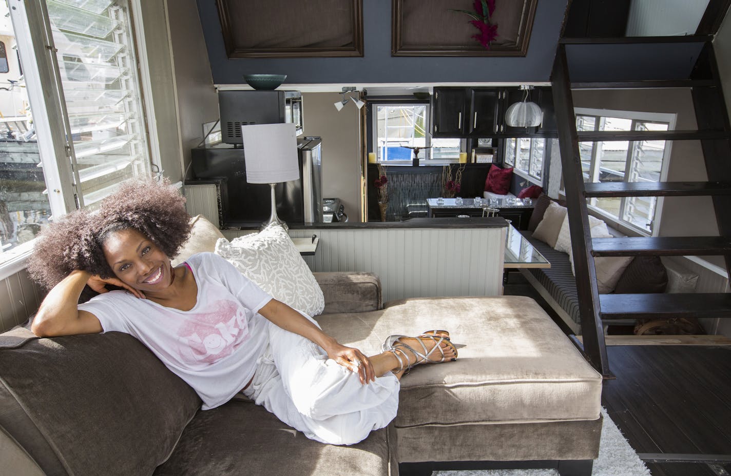 Austene Van relaxed in the main living area of her remodeled houseboat, where she lives year-round. &#x201c;Water has always made me feel at home &#x2014; peaceful, sane and creative,&#x201d; she said.