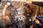 Houston Astros players celebrated on Wednesday night after beating the Twins in an ALDS at Target Field.
