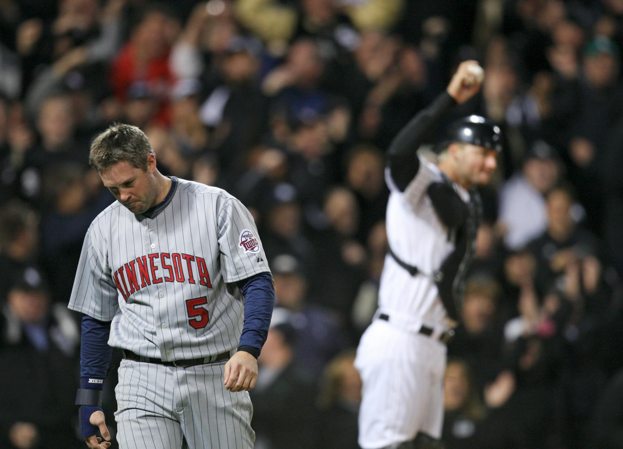 Michael Cuddyer was out at home after crashing into White Sox catcher A.J. Pierzynski to end the fifth inning. Cuddyer, who had one of the Twins' two hits, had tagged up from third and was thrown out by center fielder Ken Griffey Jr. The White Sox won the AL Central title.