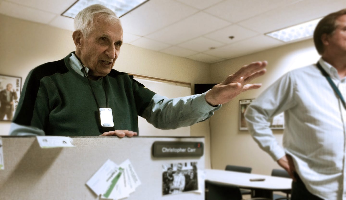 Sid Hartman holds court in the Star Tribune sports department in April of 2014.