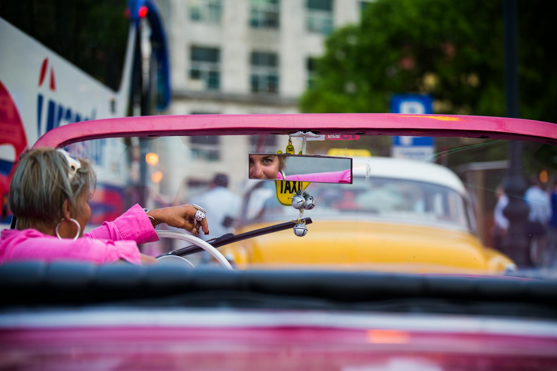 A woman waits for taxi fares in an antique American car in Old Havana, Cuba on Thursday, May 14, 2015. ] LEILA NAVIDI leila.navidi@startribune.com /