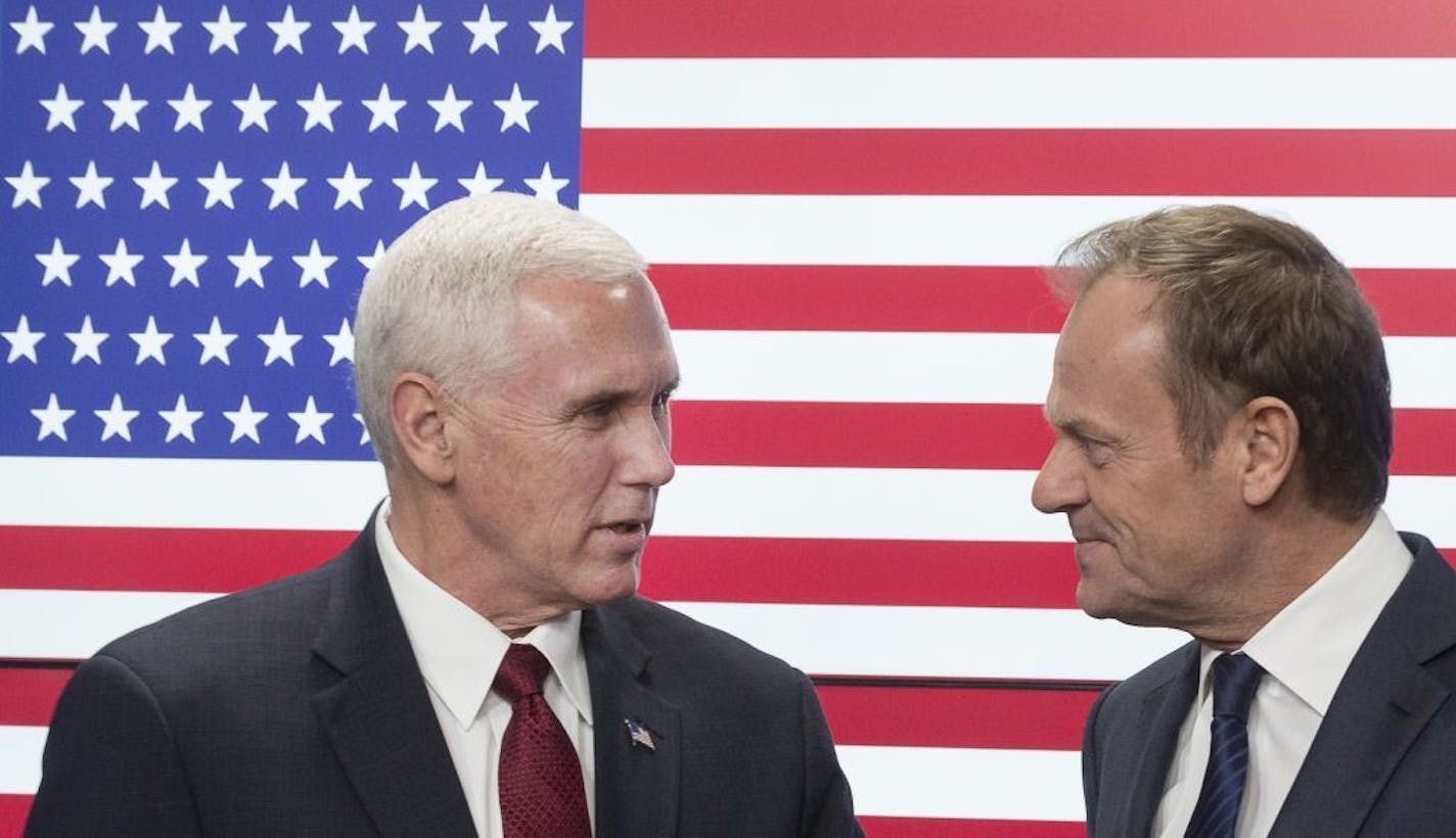 United States Vice President Mike Pence, left, and EU Council President Donald Tusk pose for photographers as Pence arrives at the European Council building in Brussels, Belgium, on Monday, Feb. 20, 2017. Pence is currently on a one day trip to Brussels to meet with EU and NATO officials.