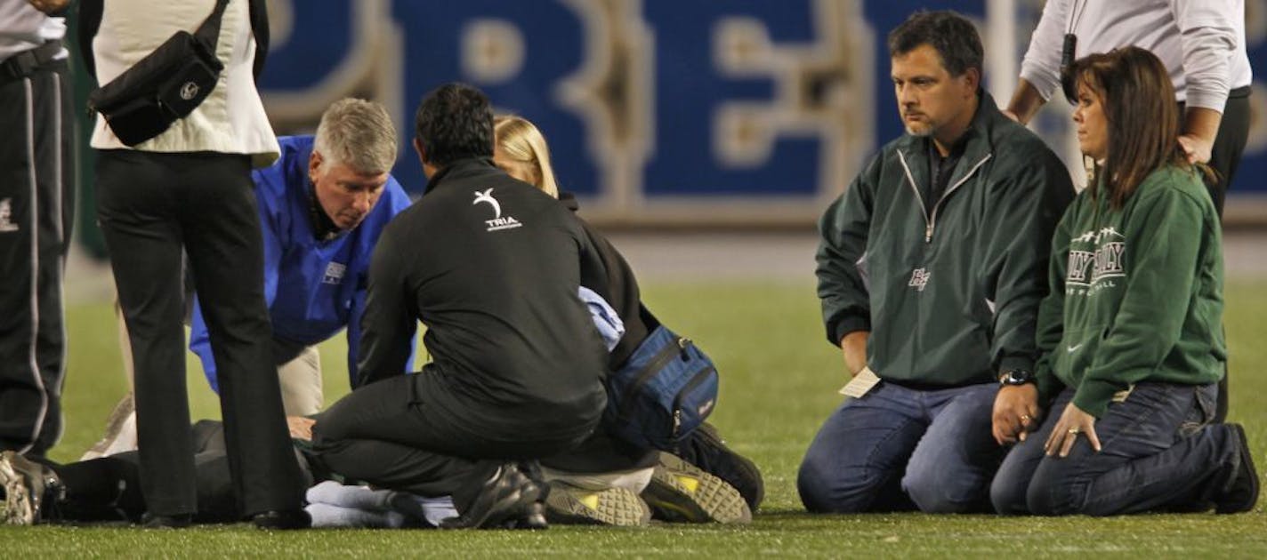 An injured player at the 2010 Prep Bowl. Two University of Minnesota doctors are recommending that the nation's schools eliminate football.