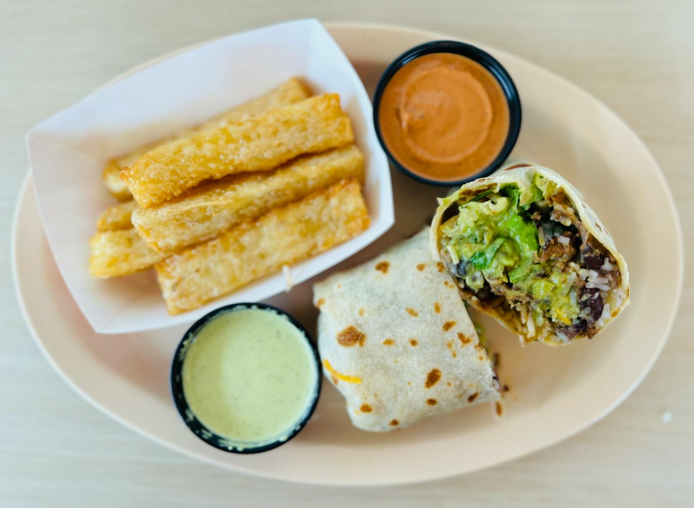 Mini stuffed burrito with a side of golden yuca fries at Listo, the Tex Mex spot at The Quarry in Minneapolis.