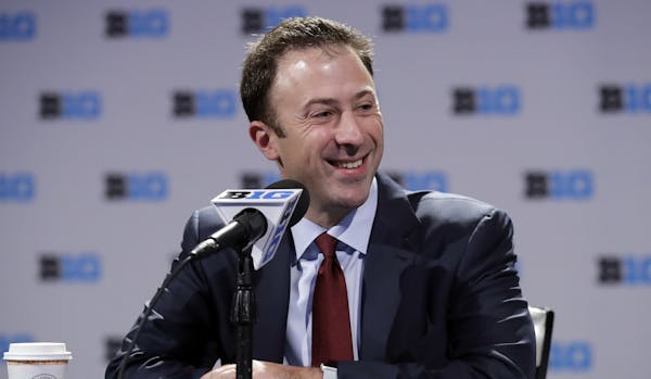 Minnesota head coach Richard Pitino smiles as he speaks at a press conference during Big Ten NCAA college basketball media day Thursday, Oct. 11, 2018