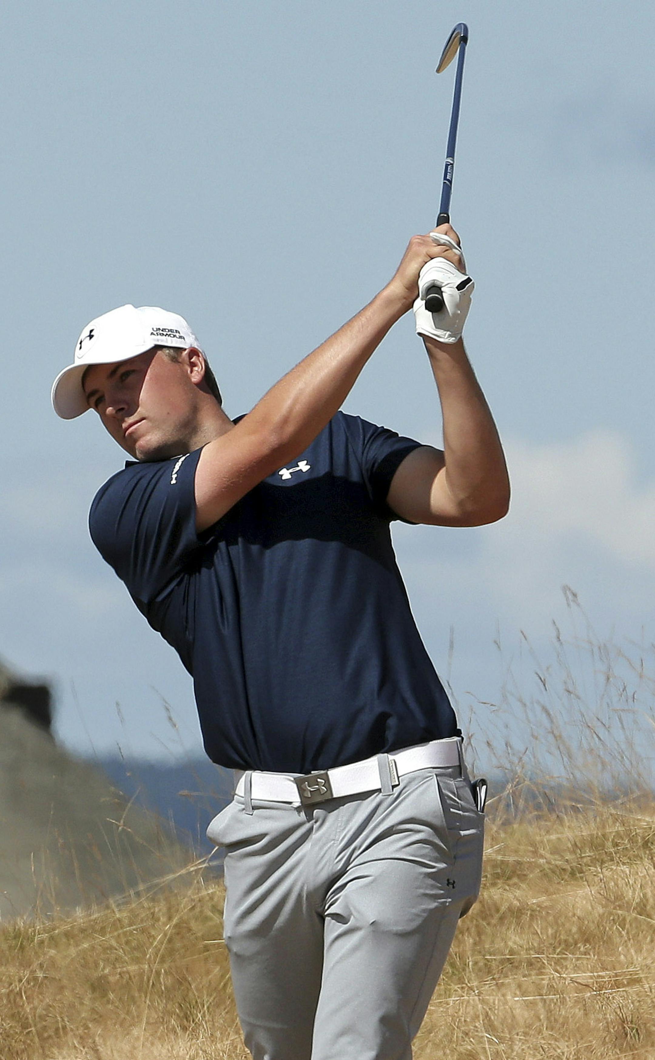 Jordan Spieth hits out of the tall fescue grass on the 18th hole during the second round of the U.S. Open golf tournament at Chambers Bay on Friday, June 19, 2015 in University Place, Wash. (AP Photo/Charlie Riedel)