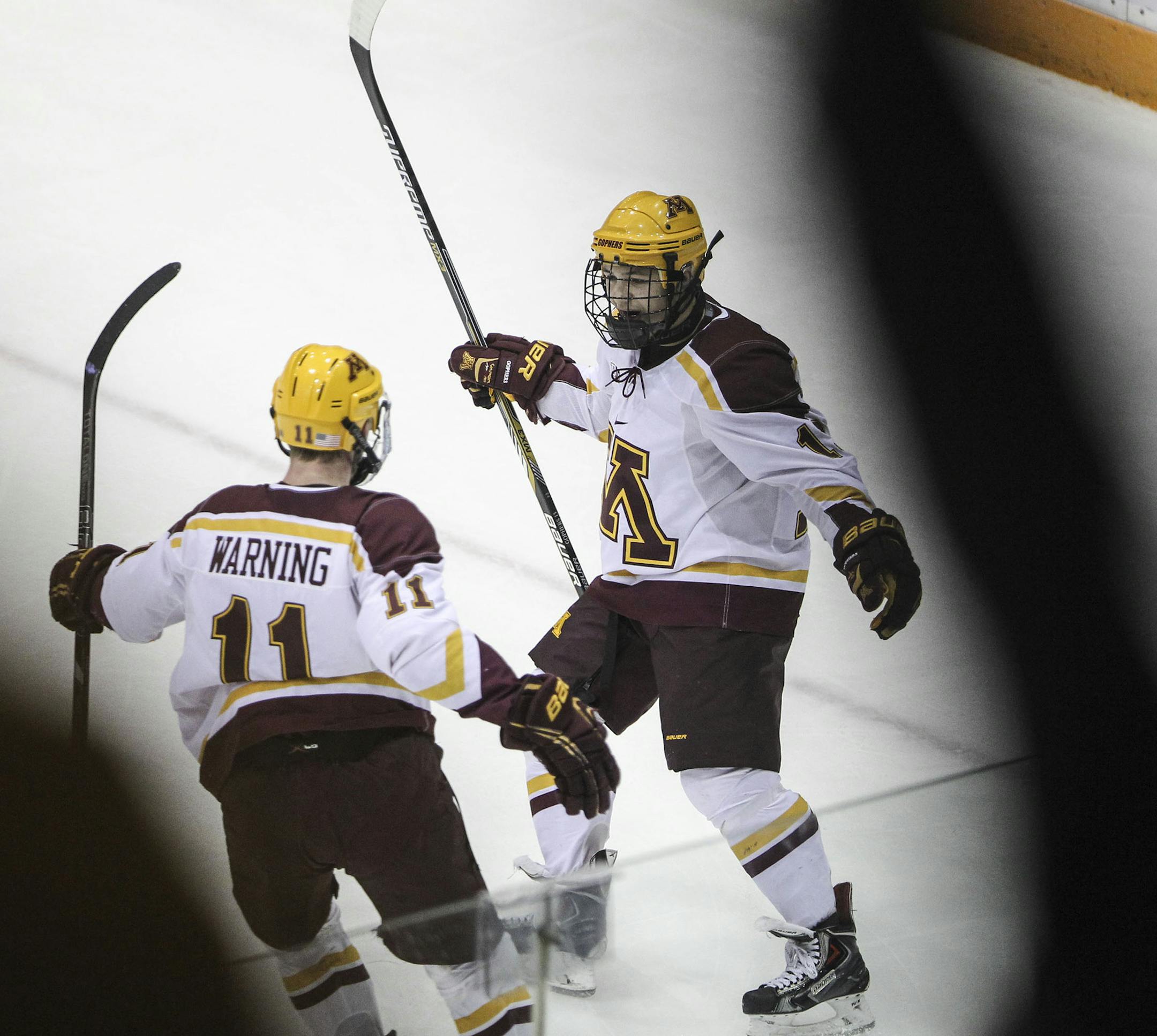 University of Minnesota Gophers' Taylor Cammarata (13) celebrates his first period goal with teammate Sam Warning (11) against Bemidji State during first period at Mariucci Arena on the University of Minnesota campus Friday, Oct. 24, 2014, in Minneapolis, MN.](DAVID JOLES/STARTRIBUNE)djoles@startribune.com Gophers men vs. Bemidji State in men's hockey at Mariucci Arena on the University of Minnesota campus Friday, Oct. 24, 2014, in Minneapolis, MN.