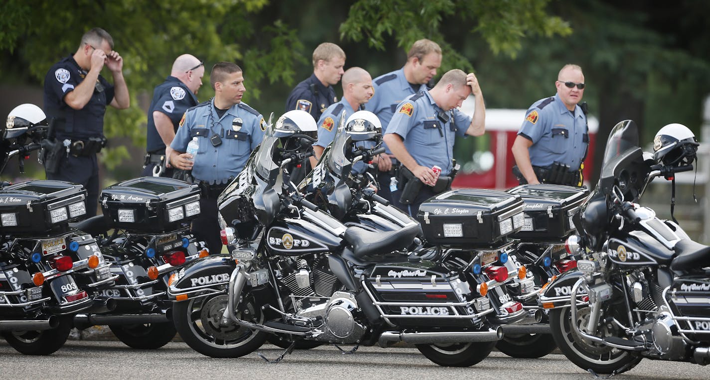 S.t Paul Police gathered at the church during Visitation for slain Mendota Heights police officer Scott Patrick at St. Stephen's Lutheran Church Tuesday August 5 , 2014 in West St. Paul , MN . .] Jerry Holt Jerry.holt@startribune.com