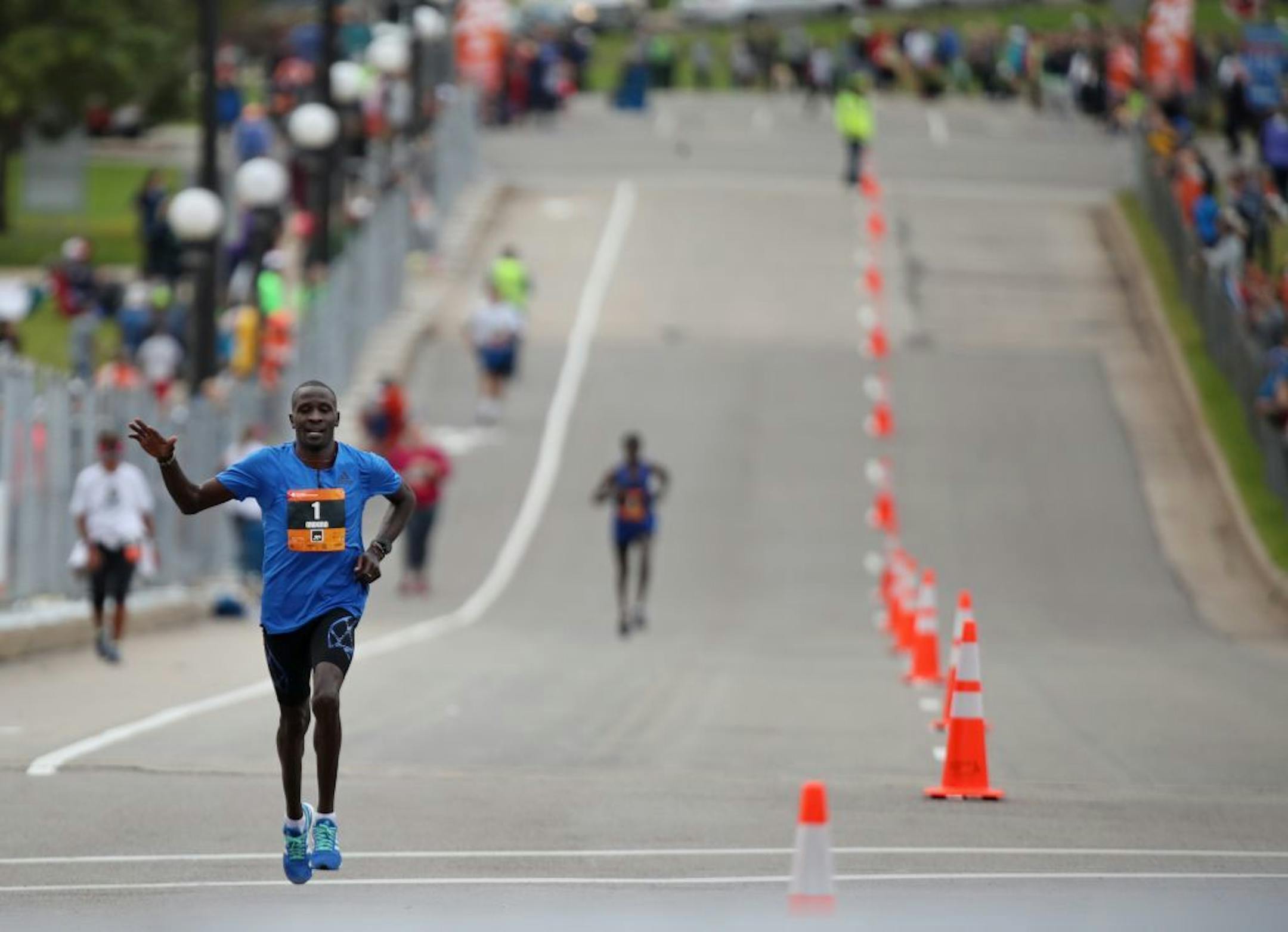 Dominic Ondoro won the men's division as he approached the finish line at the Capitol of the Twins Cities Marathon Sunday October 1,2017 in St. Paul, MN.