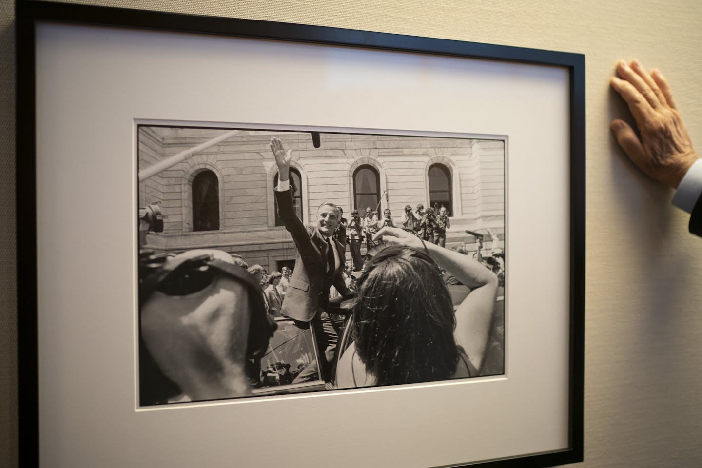 Former Vice President Walter Mondale paused by a photo hanging in the hallway outside his office from July of 1984 at the State Capital in St. Paul after he announced that Geraldine Ferraro would be his running mate.