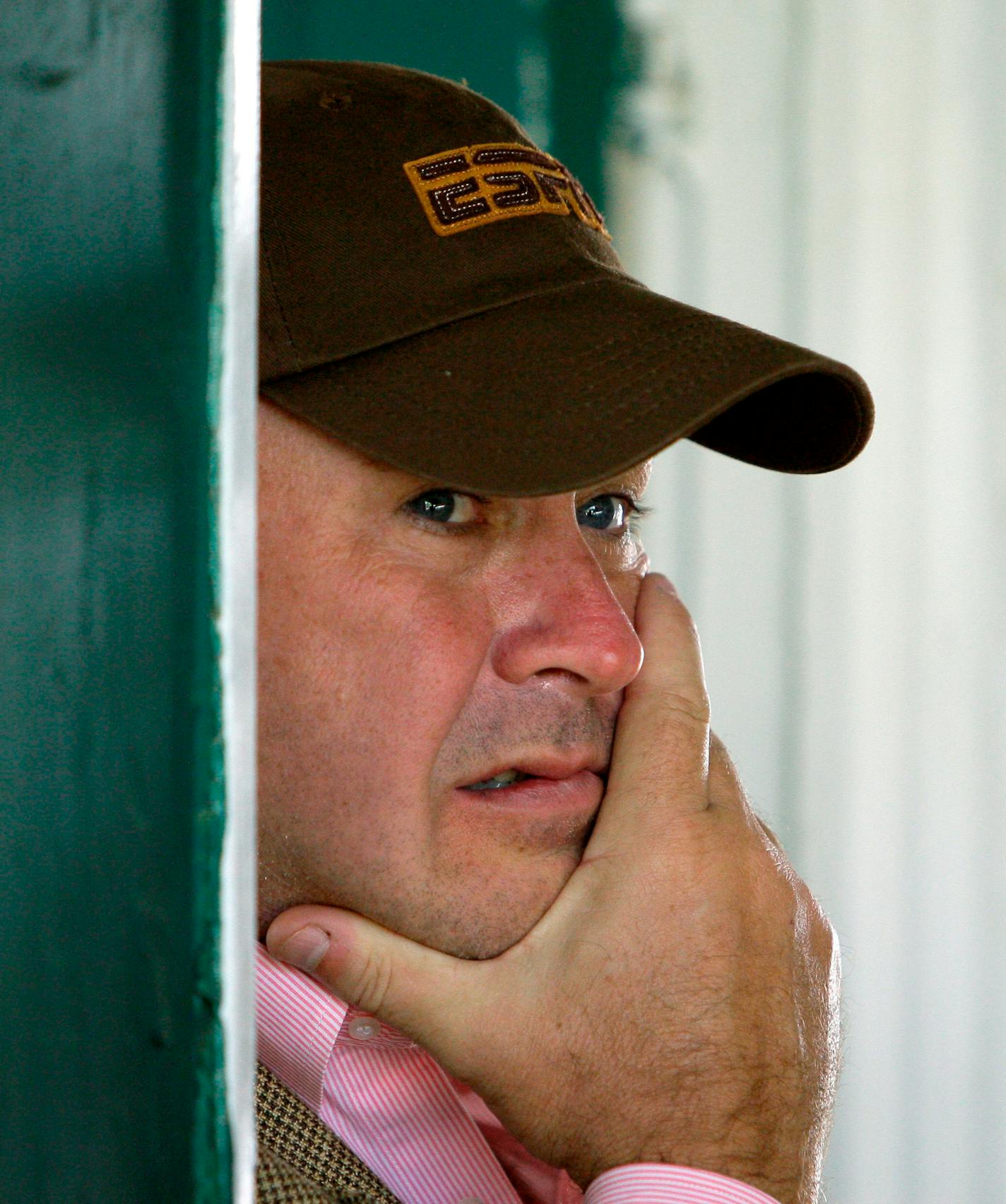 Rick Dutrow Jr., trainer of Kentucky Derby and Preakness winner Big Brown looks out from the stakes barn at Pimlico Race Course, Monday, May 19, 2008, in Baltimore. Dutrow is shipping the horse to New York for the the third leg of the Triple Crown at Belmont.