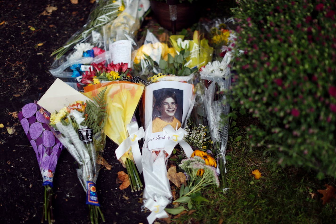 A photograph of Jacob Wetterling and flowers were placed at his parents home in September 2016, days after Danny Heinrich revealed where Jacob's body could be found.