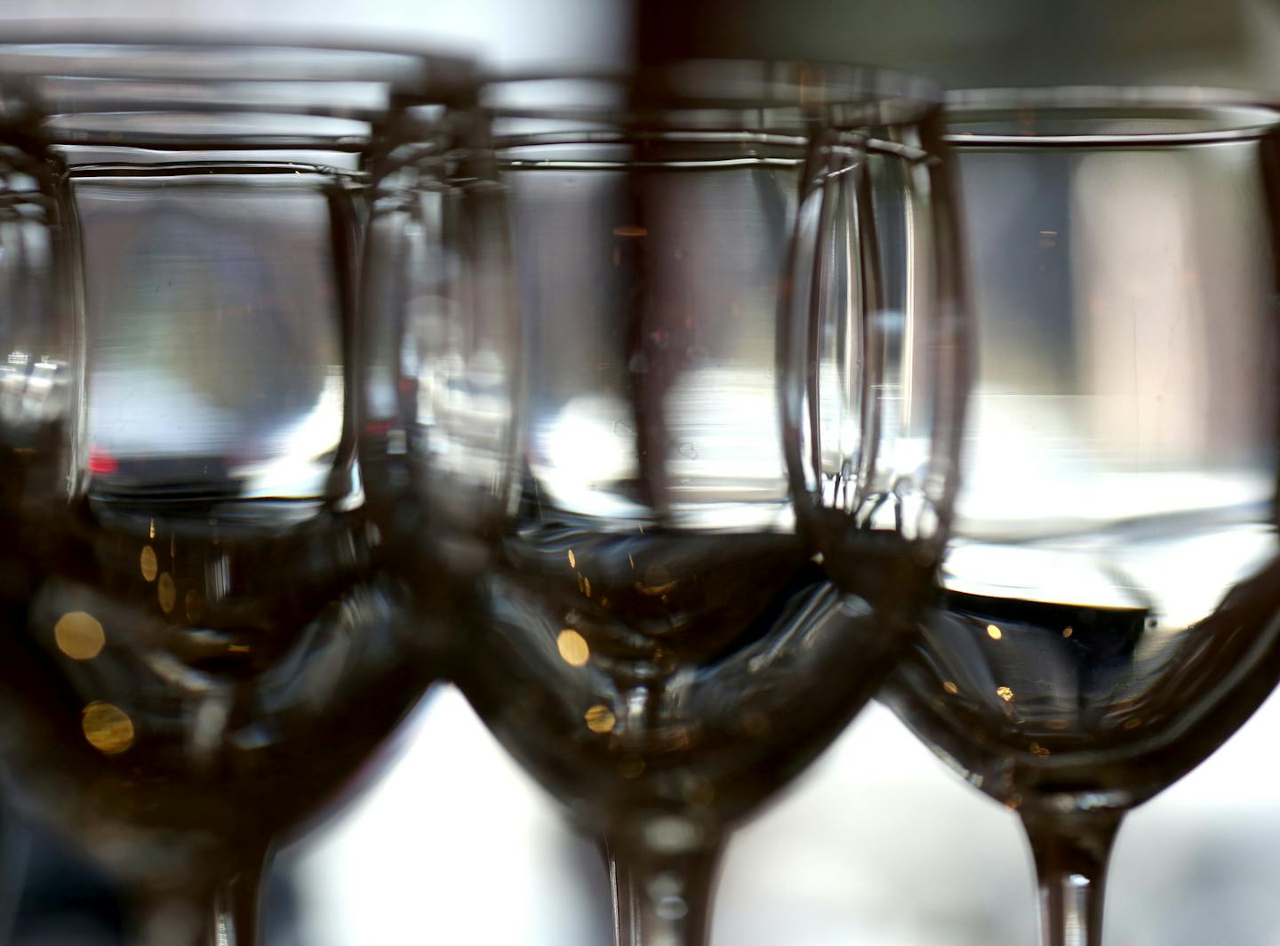 Wine glasses lined the shelf behind the bar at Beaujo's. ] (KYNDELL HARKNESS/STAR TRIBUNE) kyndell.harkness@startribune.com At Beaujo's in Minneapolis, Min., Thursday, February 19, 2015.