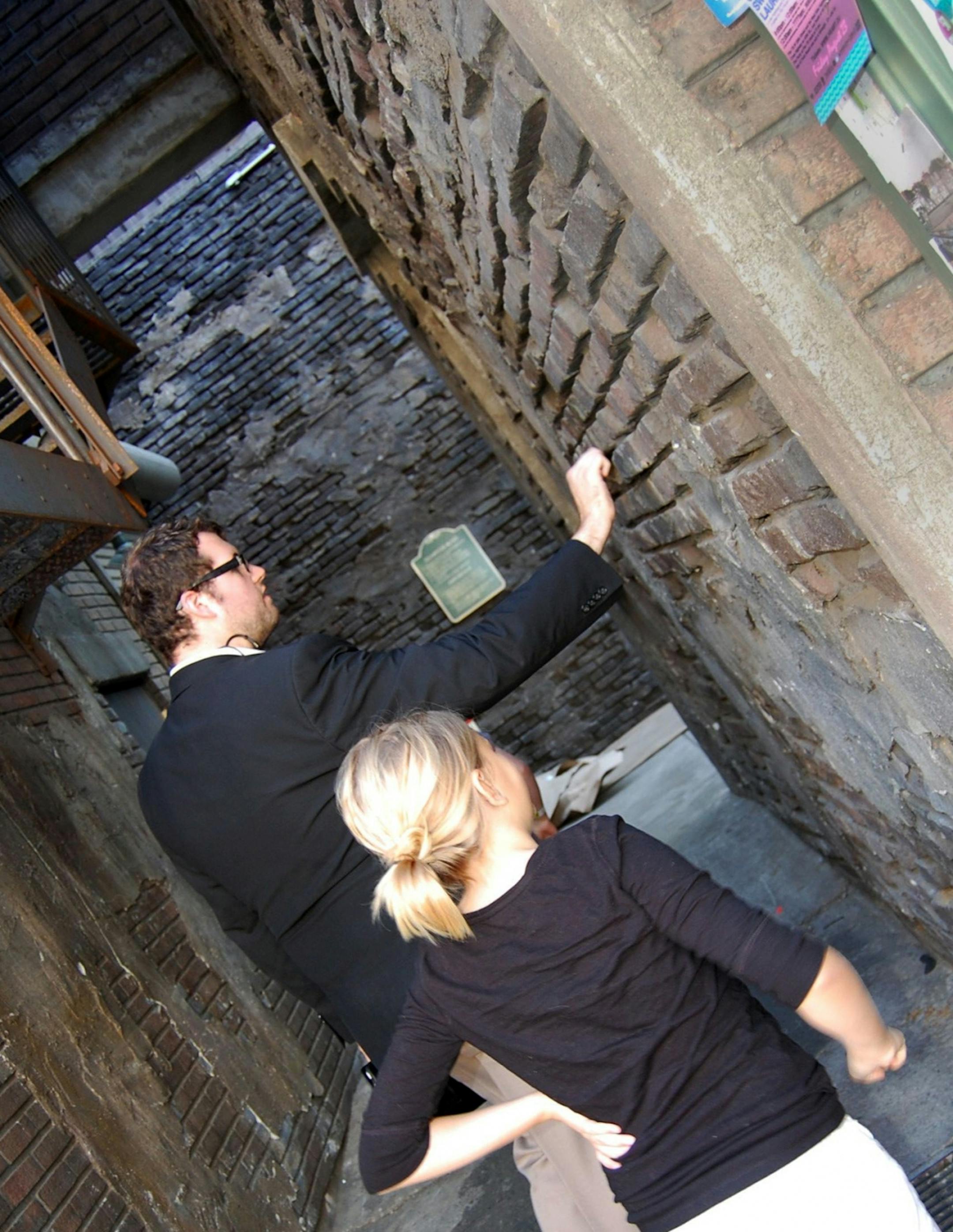 A Paramount Pictures tour guide shows Lindsay Hatch that the brick buildings in the New York alleys on the backlot are really made of plastic.
