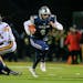 Champlin Park quarterback Jaice Miller (4) was offered a preferred walk-on spot by the Gophers a few days before leading the Rebels into the Prep Bowl