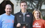 The LaVallee family, husband Greg, son Marcus and wife Amy with a photo of the LaVallee's oldest son Phillip. Phillip was hit by a distracted driver w