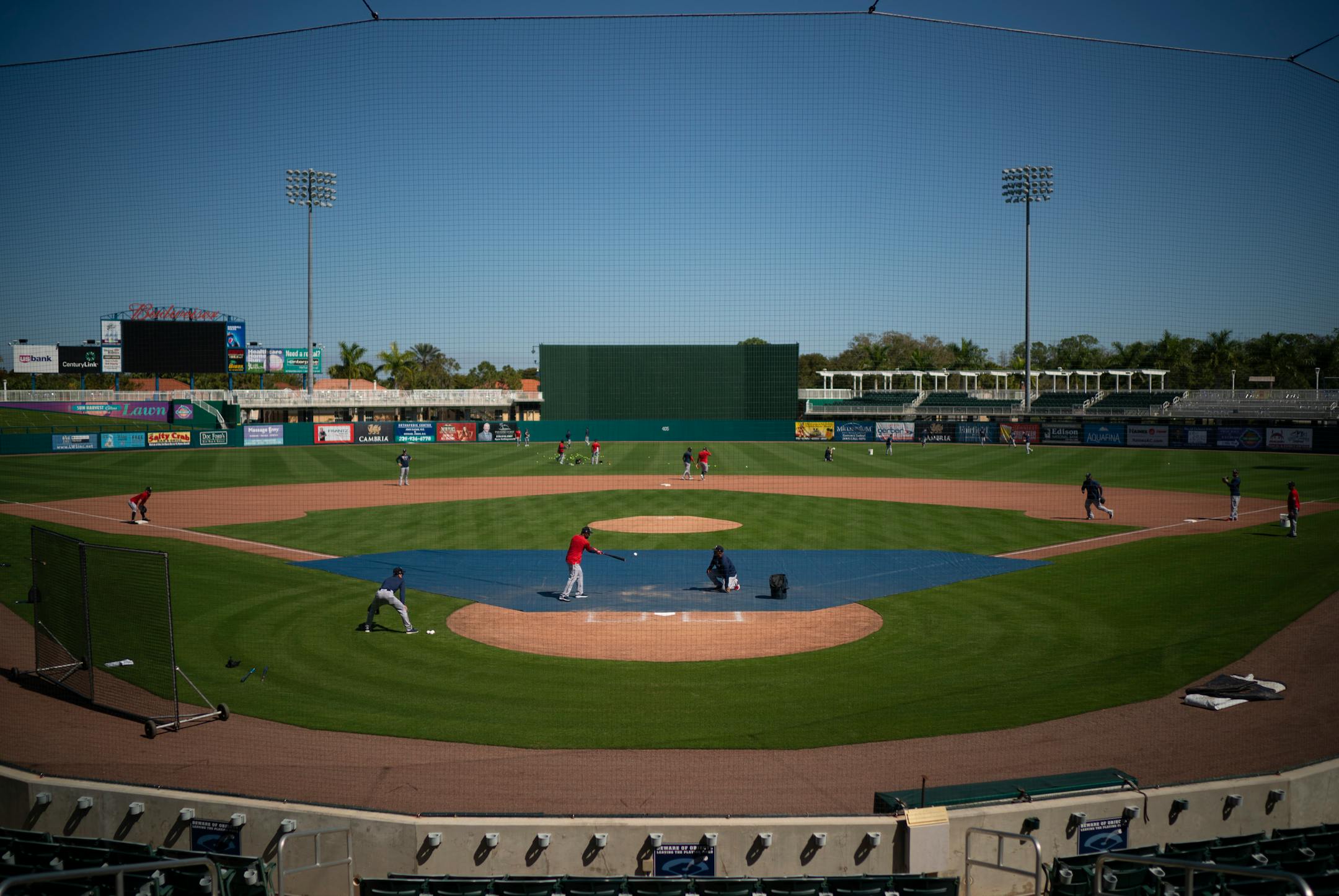 Twins third base coach Tony Diaz hit the ball during a drill for infielders during the first full squad workout Tuesday morning.