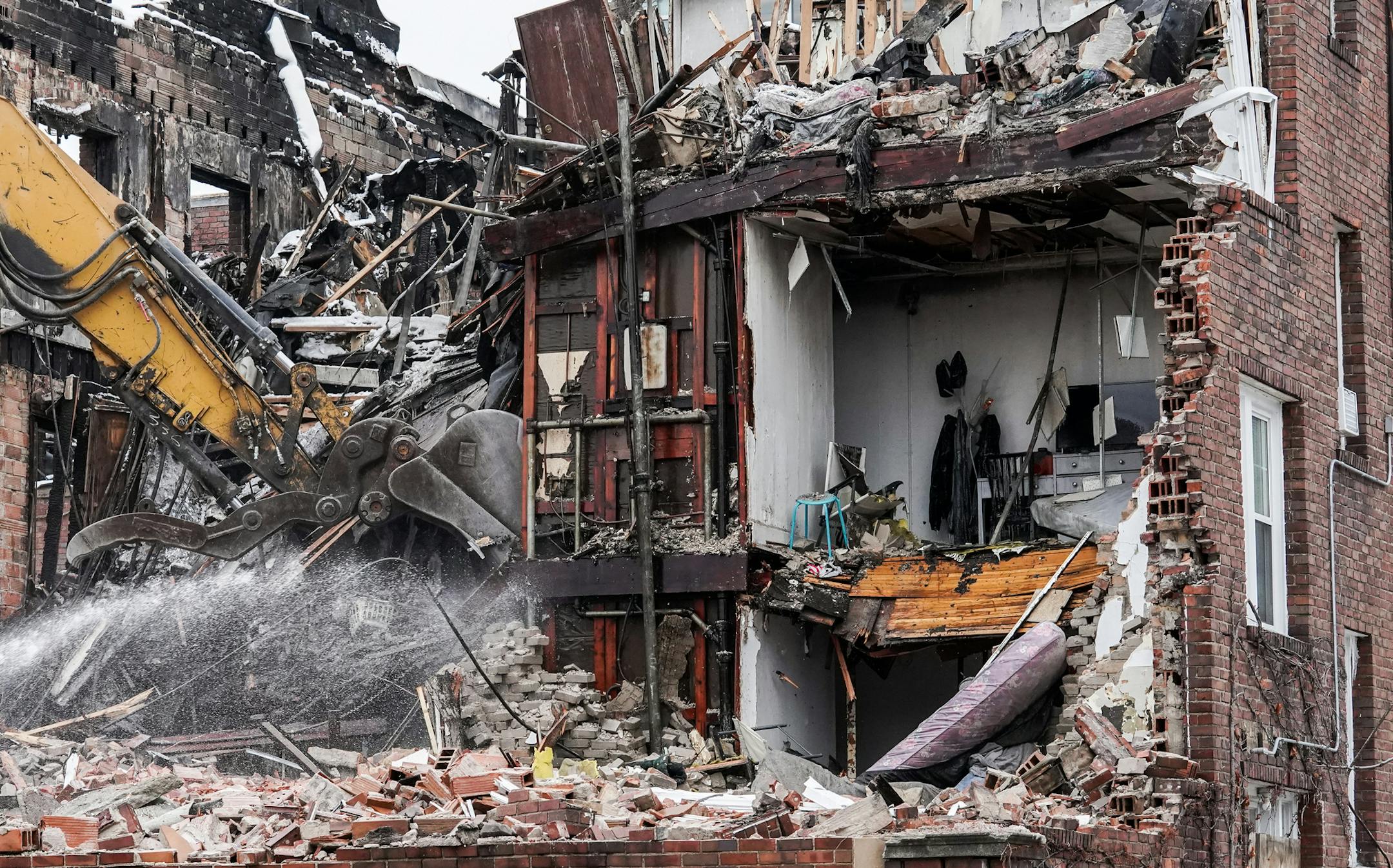 While the fire gutted most of the upper floors, some apartments seemed untouched by the blaze. ] MARK VANCLEAVE ¥ Demolition crews used heavy machinery to raze the eastern section of the Francis Drake Hotel on Thursday, Jan. 2, 2020 in Minneapolis.