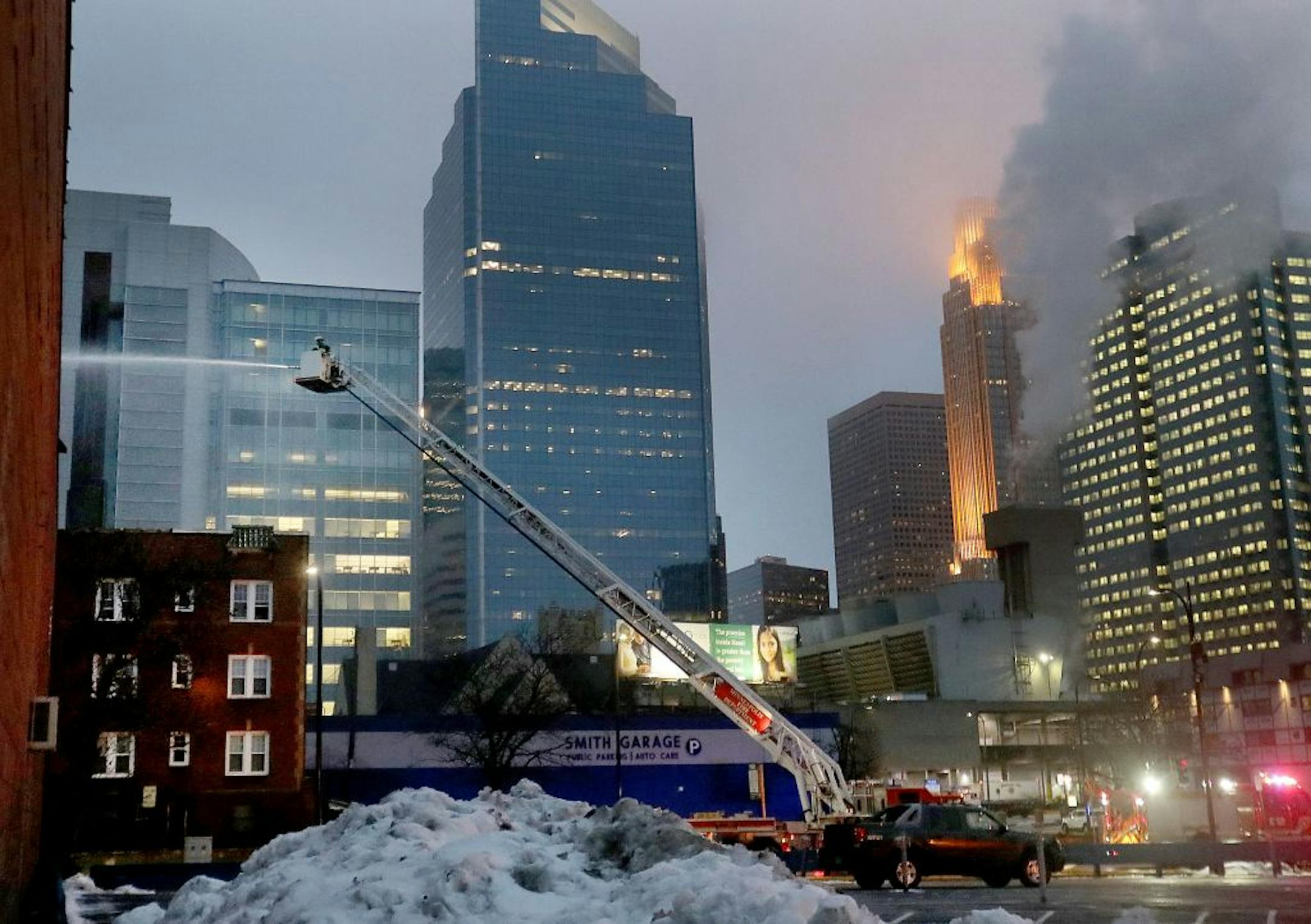 As dawn broke, Minneapolis firefighters continued putting water on the Francis Drake Hotel apartments, a day after a Christmas Day fire at the Drake, where more than 200 people were displaced and seen Thursday, Dec. 26, 2019, in Minneapolis MN.
