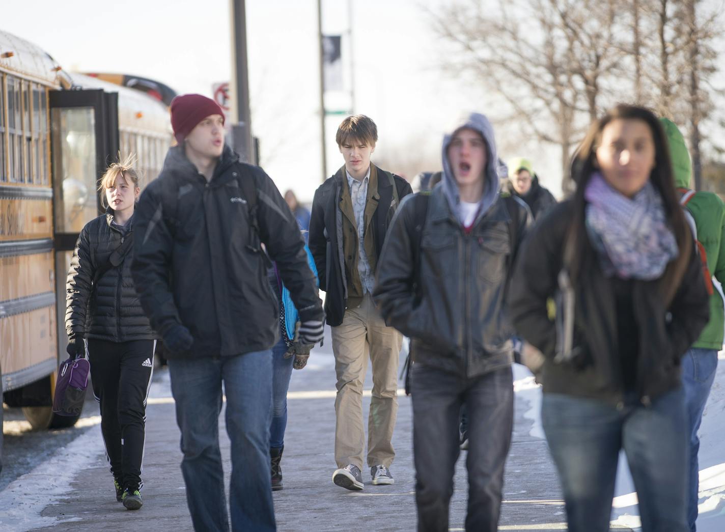 Central High School students leave school in sub-zero temperatures on Wednesday afternoon. ] (Aaron Lavinsky | StarTribune) Students at Central High School in St. Paul brave the cold as they are let out of class on Wednesday, Jan. 7, 2014. With temperature below zero, the Minneapolis School District decided to give students and faculty a day off. The St. Paul School district went ahead with planned classes.