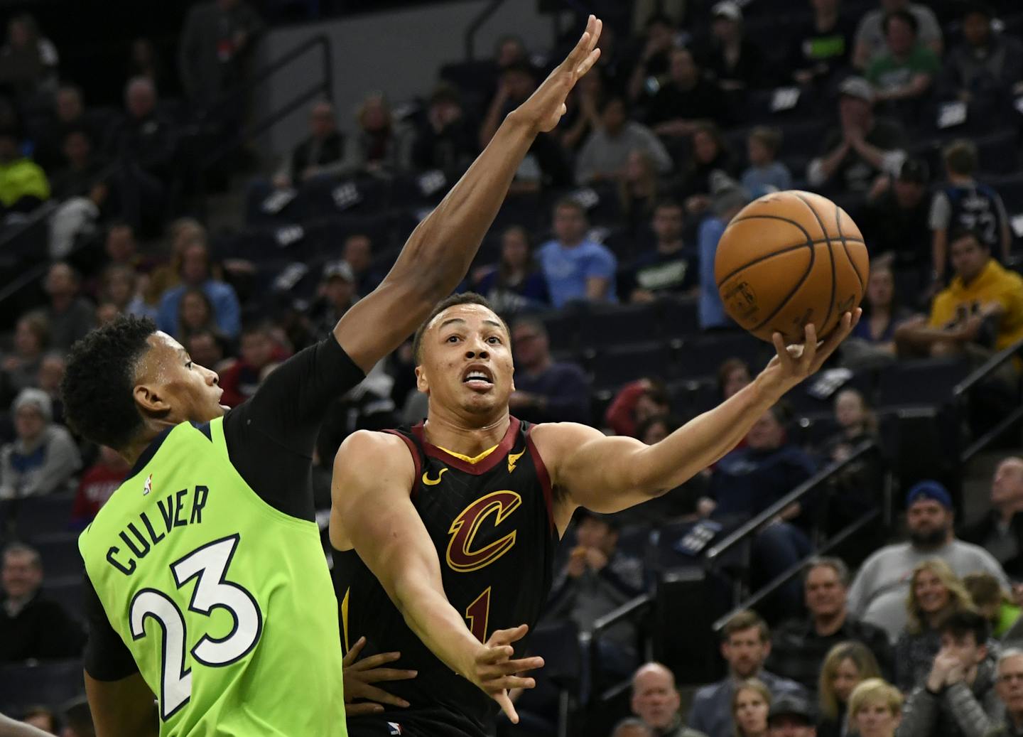 Cleveland Cavaliers' Dante Exum (1) shoots a layup against Minnesota Timberwolves' Jarrett Culver (23) during the second quarter of an NBA basketball game on Saturday, Dec. 28, 2019, in Minneapolis. (AP Photo/Hannah Foslien)