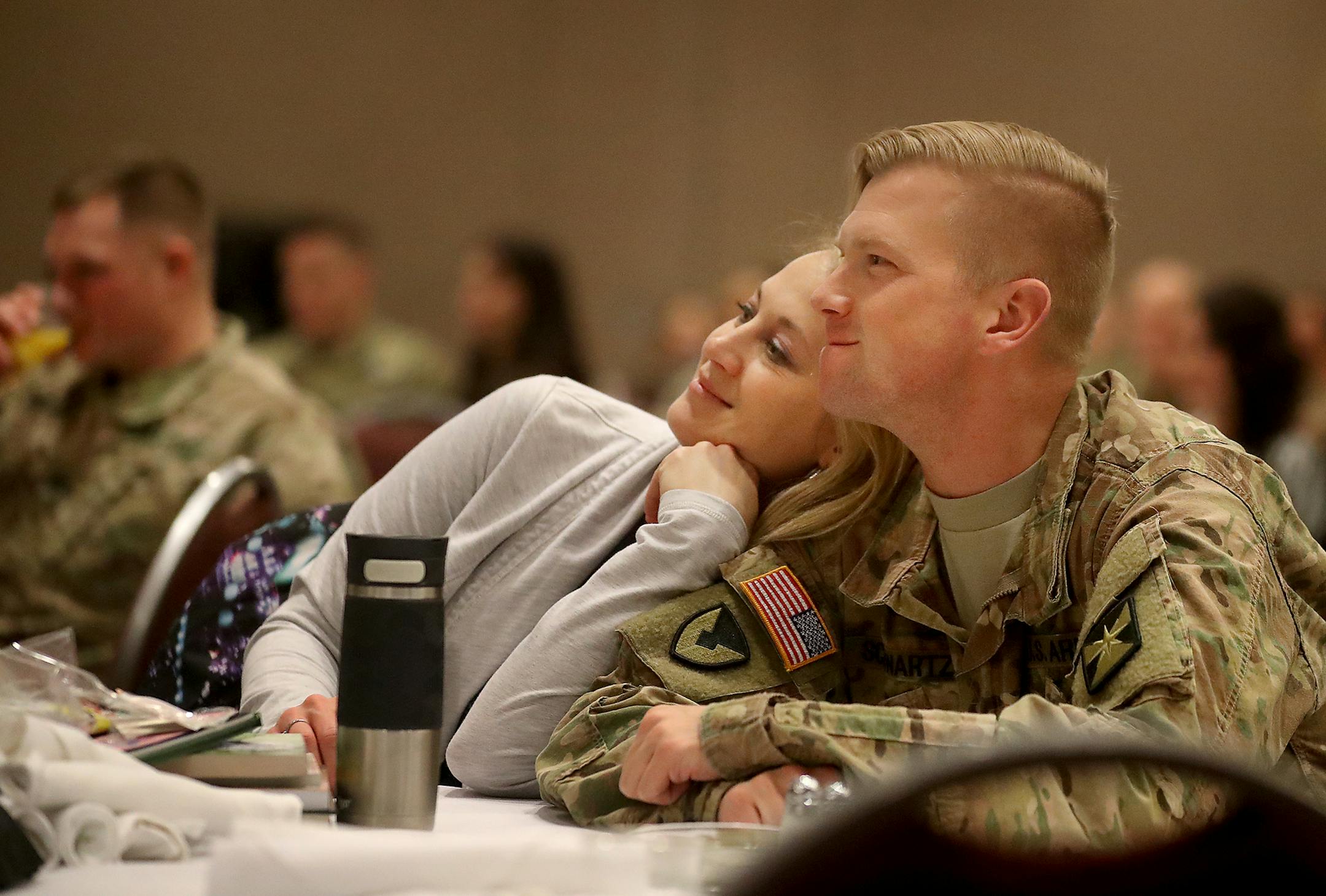 The Minnesota National Guard held a deployment ceremony for the 347th Regional Support Group, who are deploying to Kuwait, and a welcome home ceremony for three other Minnesota National Guard units Saturday, Feb. 10, 2018, at the Minneapolis Convention Center in Minneapolis, MN. Here. Bethany Schwartz leans into her husband SFC Jameson Schwartz who was part of a Minnesota National Guard Acquisition team that had deployed to Kuwait and returned last fall.] DAVID JOLES • david.joles@startri