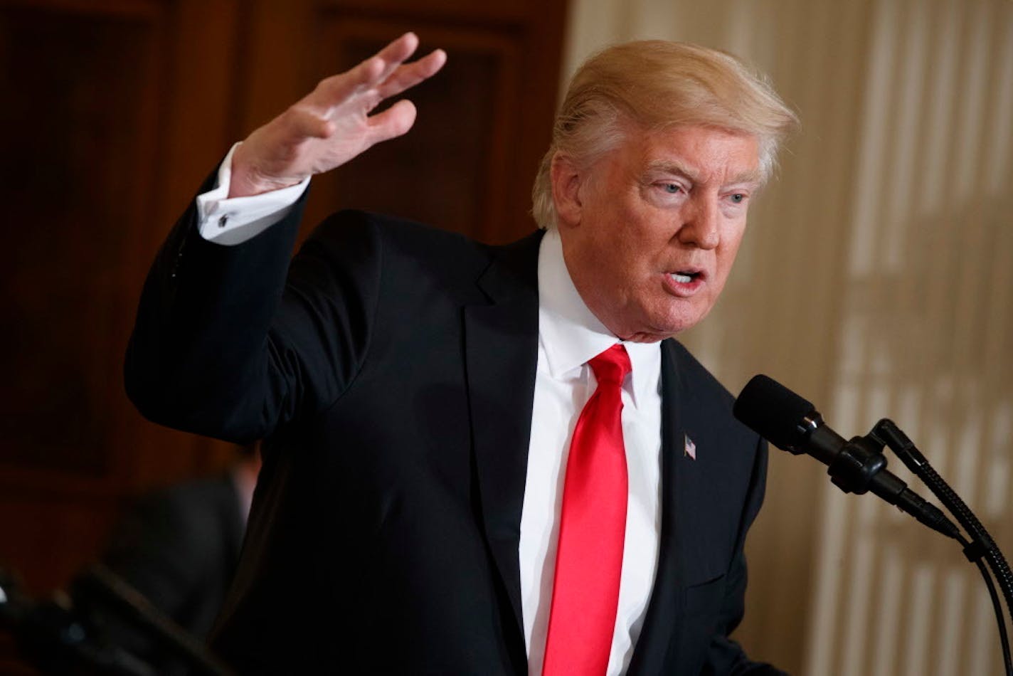 President Donald Trump speaks in the East Room of the White House in Washington, Friday, Jan. 27, 2017. Trump is eager to meet Russian President Vladimir Putin with full diplomatic bells and whistles when the two are in Germany for a multinational summit next month.