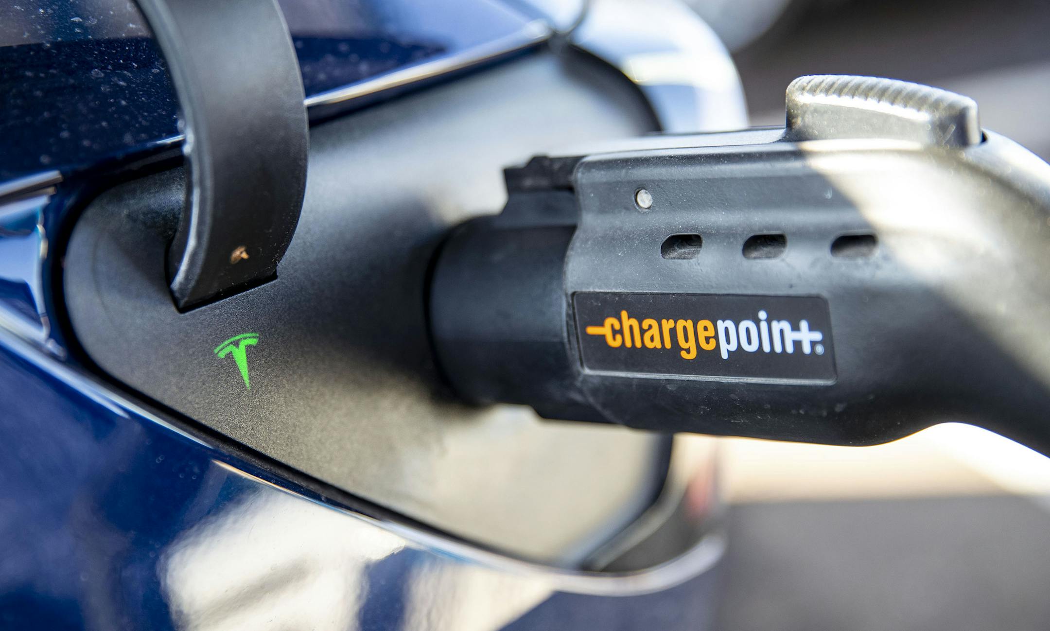 A small green light blinked on George Host's Tesla while it charged at the ChargePoint charging station near Canal Park Lodge in Duluth, MN on Thursday November 24, 2019. ] ALEX KORMANN • alex.kormann@startribune.com Minnesota is working to become the Midwestern leader for electric vehicle use - and that calls for expanding the state's charging infrastructure. Duluth has around a dozen charging stations for electric vehicles in the city with more on the way.