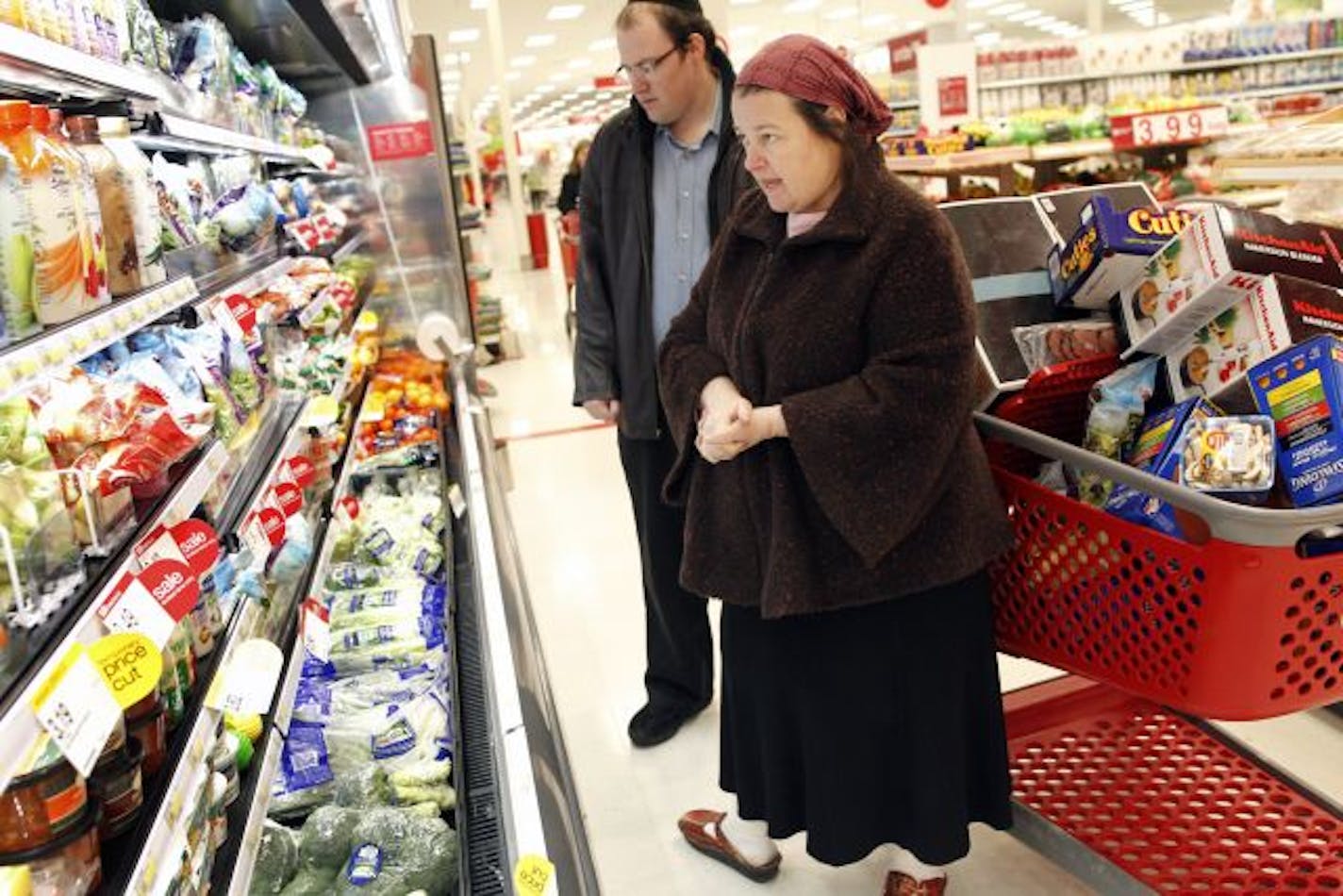 Raffi Ginsberg and her son Tzvi checked out some fresh produce last week at Target in St. Louis Park. Most large retailers who reported January results Thursday showed strong year-over-year gains.