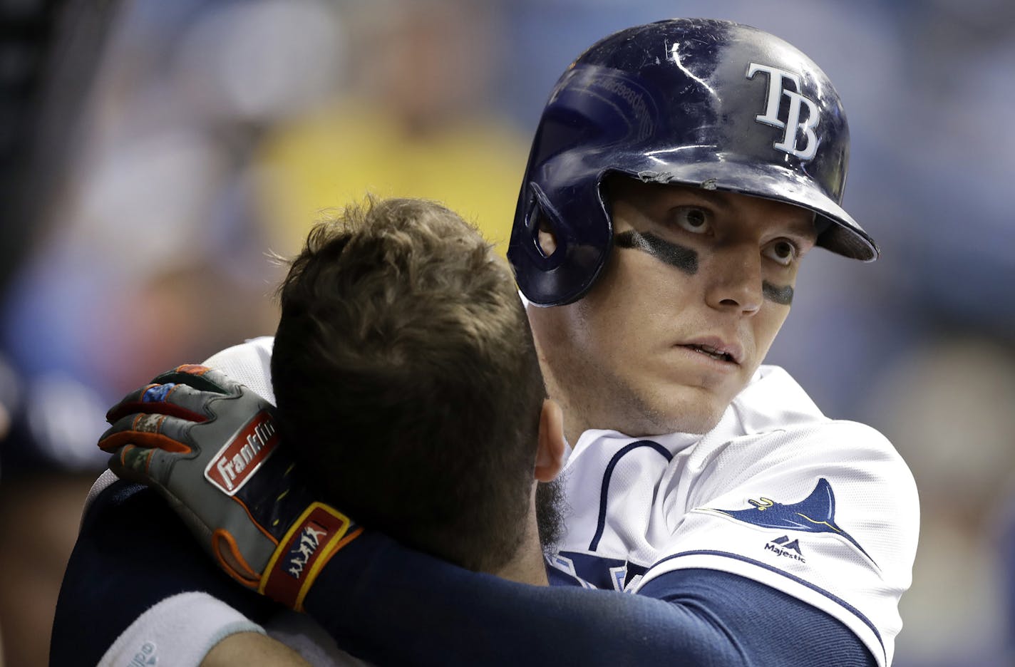 Tampa Bay Rays' Logan Morrison, right, hugs Steven Souza Jr. after Morrison hit a home run off Baltimore Orioles relief pitcher Chris Tillman during the seventh inning of a baseball game Friday, Sept. 29, 2017, in St. Petersburg, Fla. (AP Photo/Chris O'Meara) ORG XMIT: SPD115