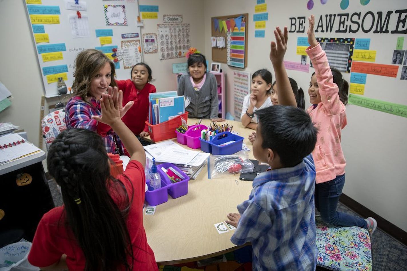 Prairie Elementary ELL third-grade teacher Mrs. Scheidt gave a high-five to a student in her small classroom that was formerly a storage closet, Monday, October 14, 2019 in Worthington, MN. The elementary school now has 1200 students enrolled. The city of Worthington is asking voters for the sixth time in six years to pass a referendum giving them the money to build a new school to help handle the boom. A half dozen times in the past several years the residents of this southwestern Minnesota tow