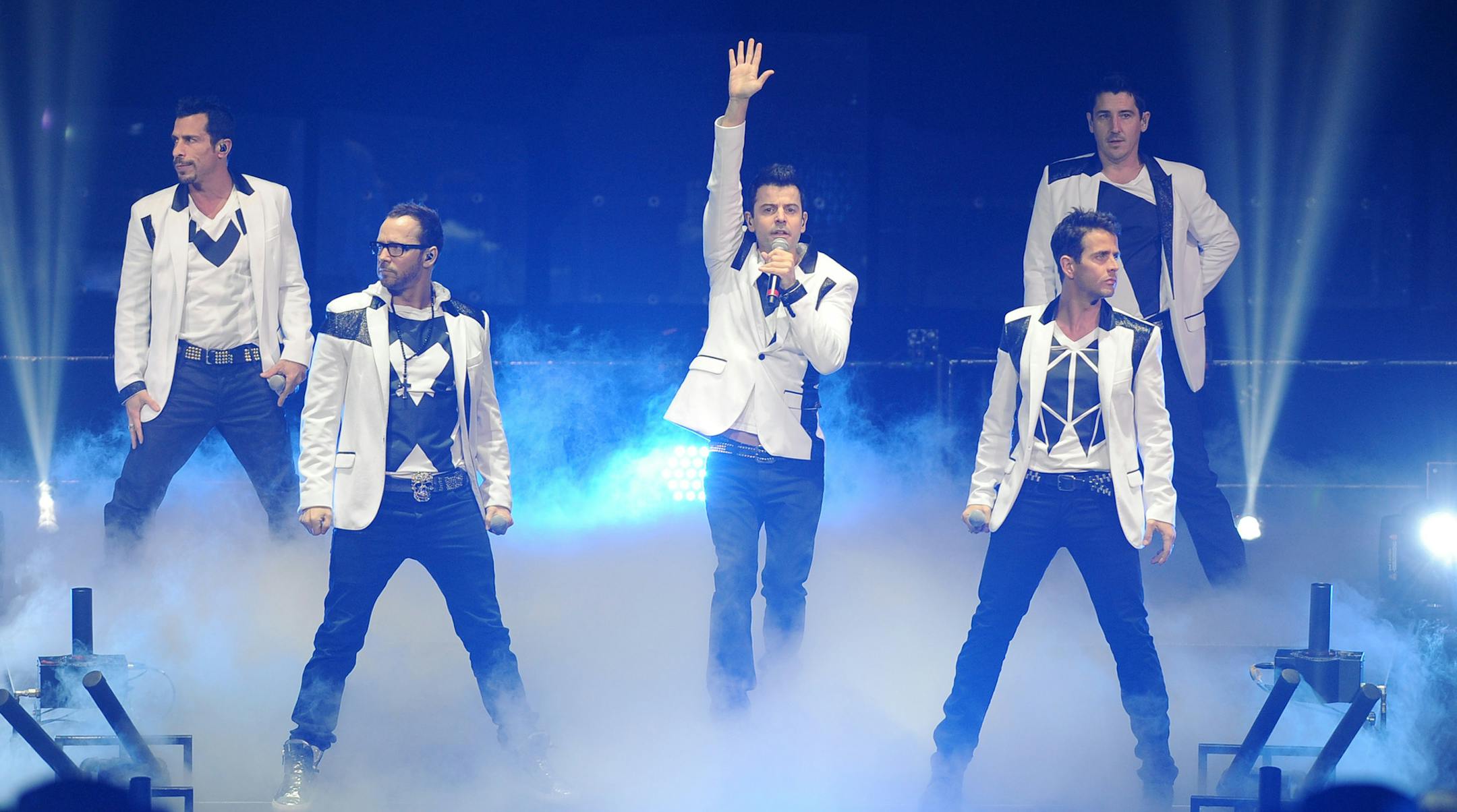 Danny Wood, Joey McIntyre, Donnie Wahlberg, Jordan Knight, and Jonathan Knight of New Kids on the Block perform during the Package Tour 2013 at the BB&T Center on June 22, 2013 in Ft Lauderdale, Florida. (Photo by Jeff Daly/Invision/AP) ORG XMIT: T