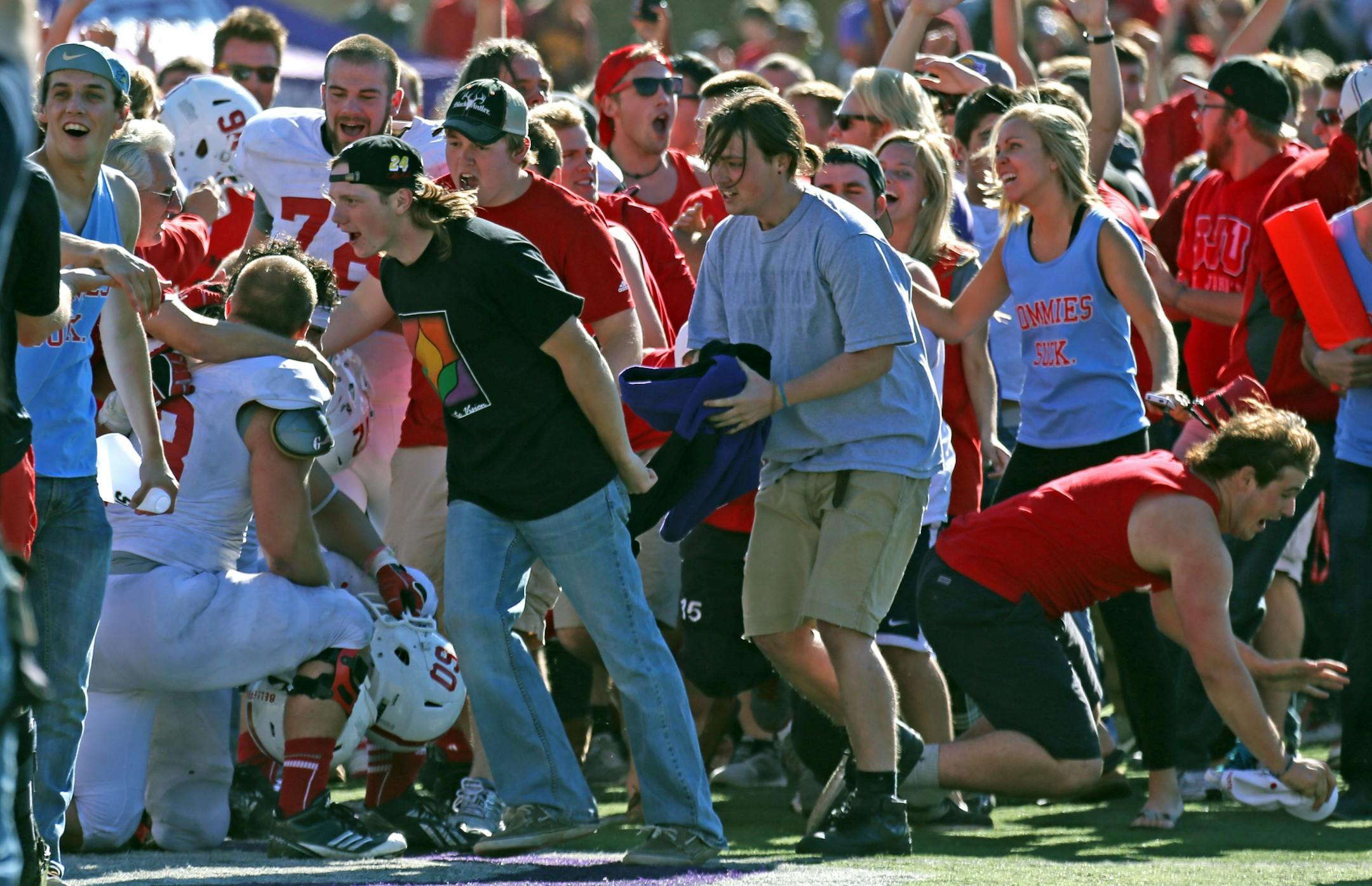 St. John's players and students celebrated their victory over St. Thomas in 2013.