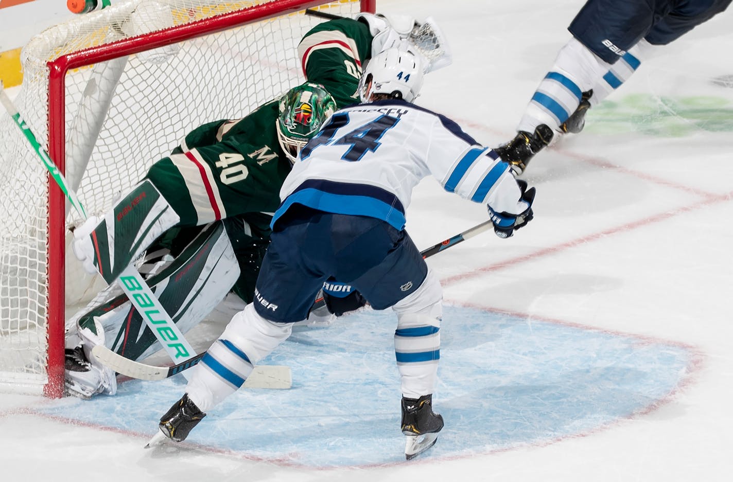 Josh Morrissey of the Jets stuffed the puck past Wild goalie Devan Dubnyk for the game-winning goal in overtime Sunday.