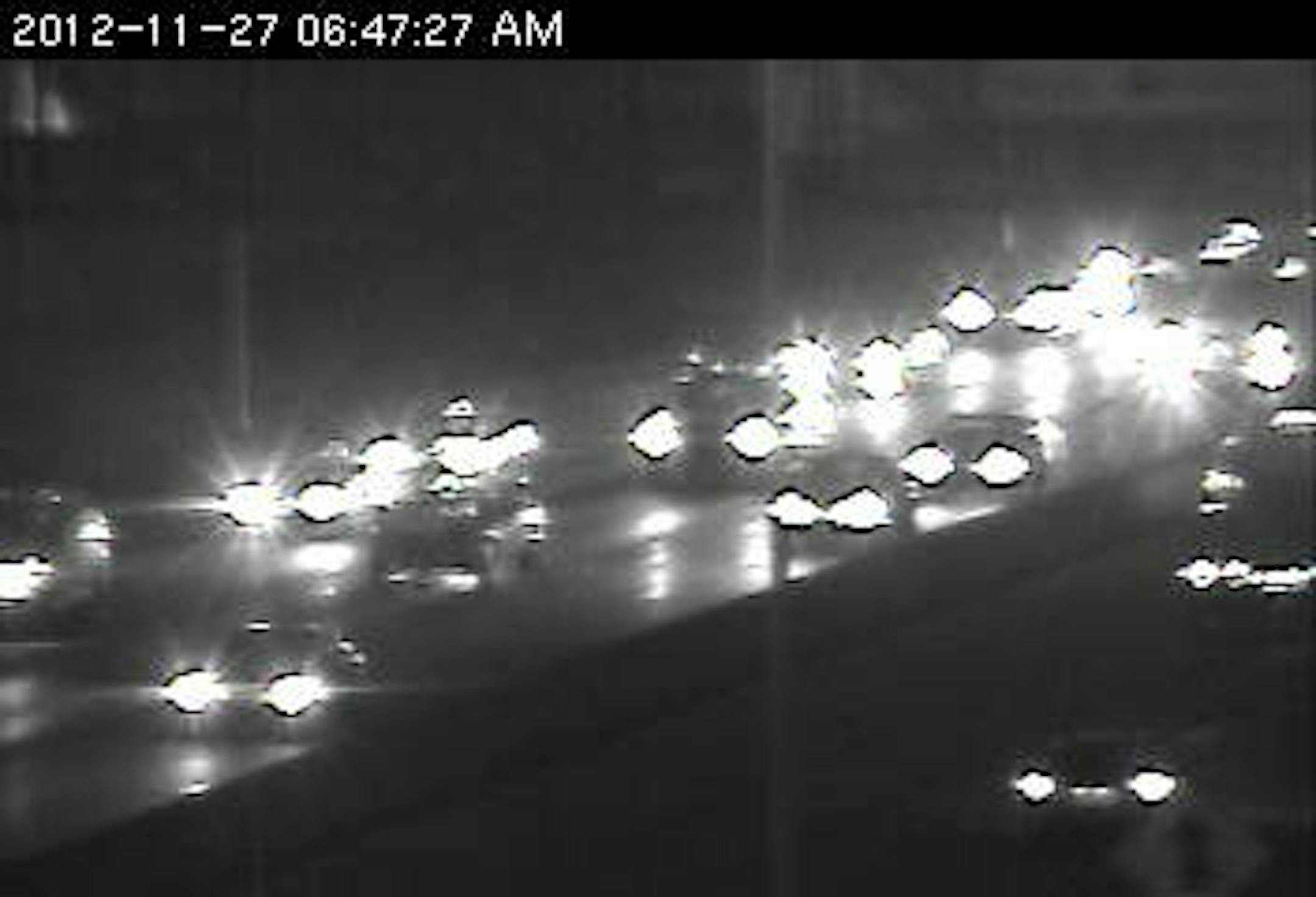 A vehicle blocking the center lane just north of 106th St. on 35W