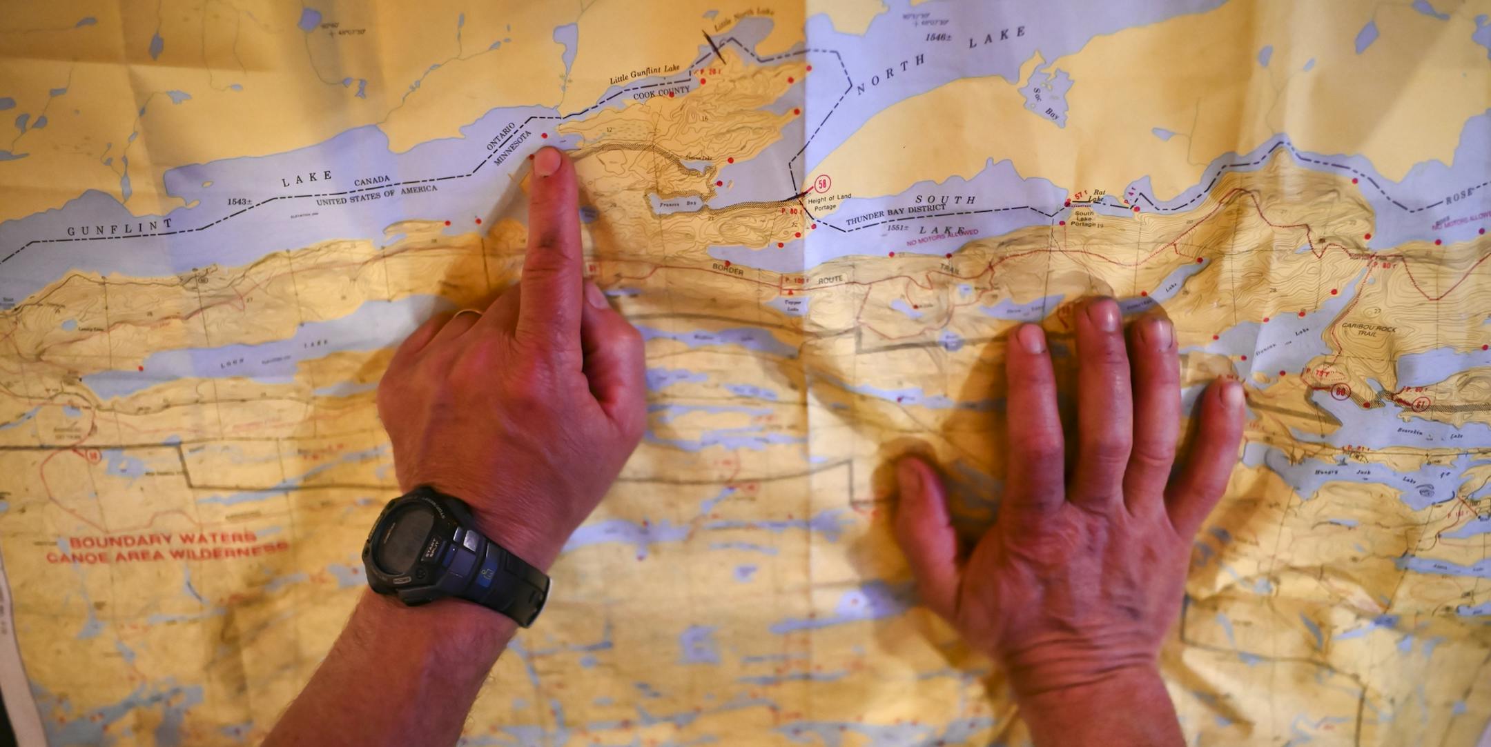 Brad Shannon, a longtime friend of Tony Jones, discussed the planned route for their trip into the BWCA Monday evening. ] Aaron Lavinsky &#xa5; aaron.lavinsky@startribune.com DAY 0 - Tony Jones and his Son Aidan, along with Bob Timmons, travelled up to Adventurous Christians, a camp located along the Gunflint Trail on their way to the the Boundary Waters Canoe Area Wilderness on Monday, June 10, 2019.