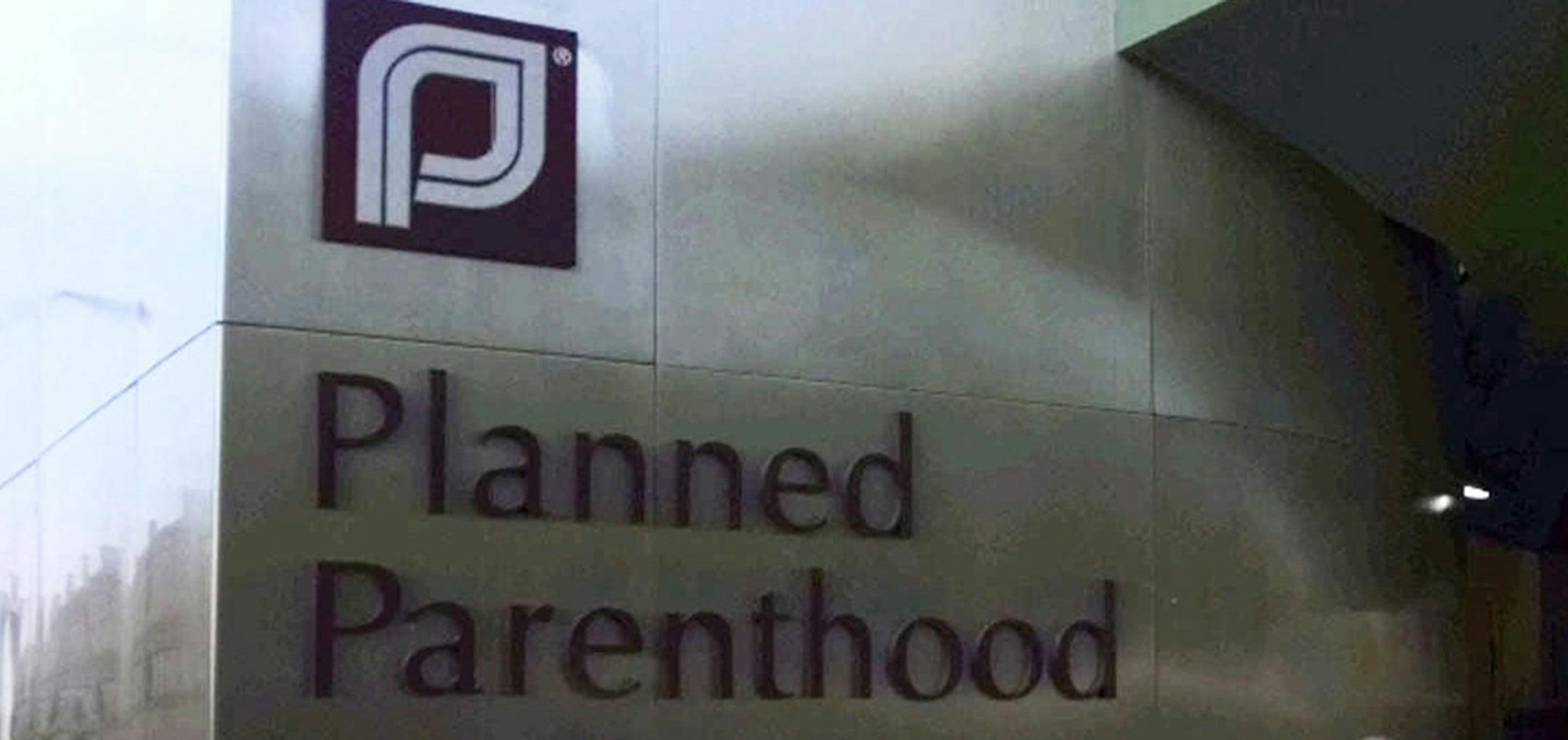 Guests arrive at the dedication for the Planned Parenthood of Massachusetts headquarters on Commonwealth Avenue in Boston, Thursday, June 25, 1998. The headquarters was designed with many modern security devices, including bullet-resistant windows, metal detectors and many high-tech monitoring devices. On Dec. 30, 1994, two workers were killed by an anti-abortion gunman at two Boston-area abortion clinics. (AP Photo/Charles Krupa) ORG XMIT: BX114