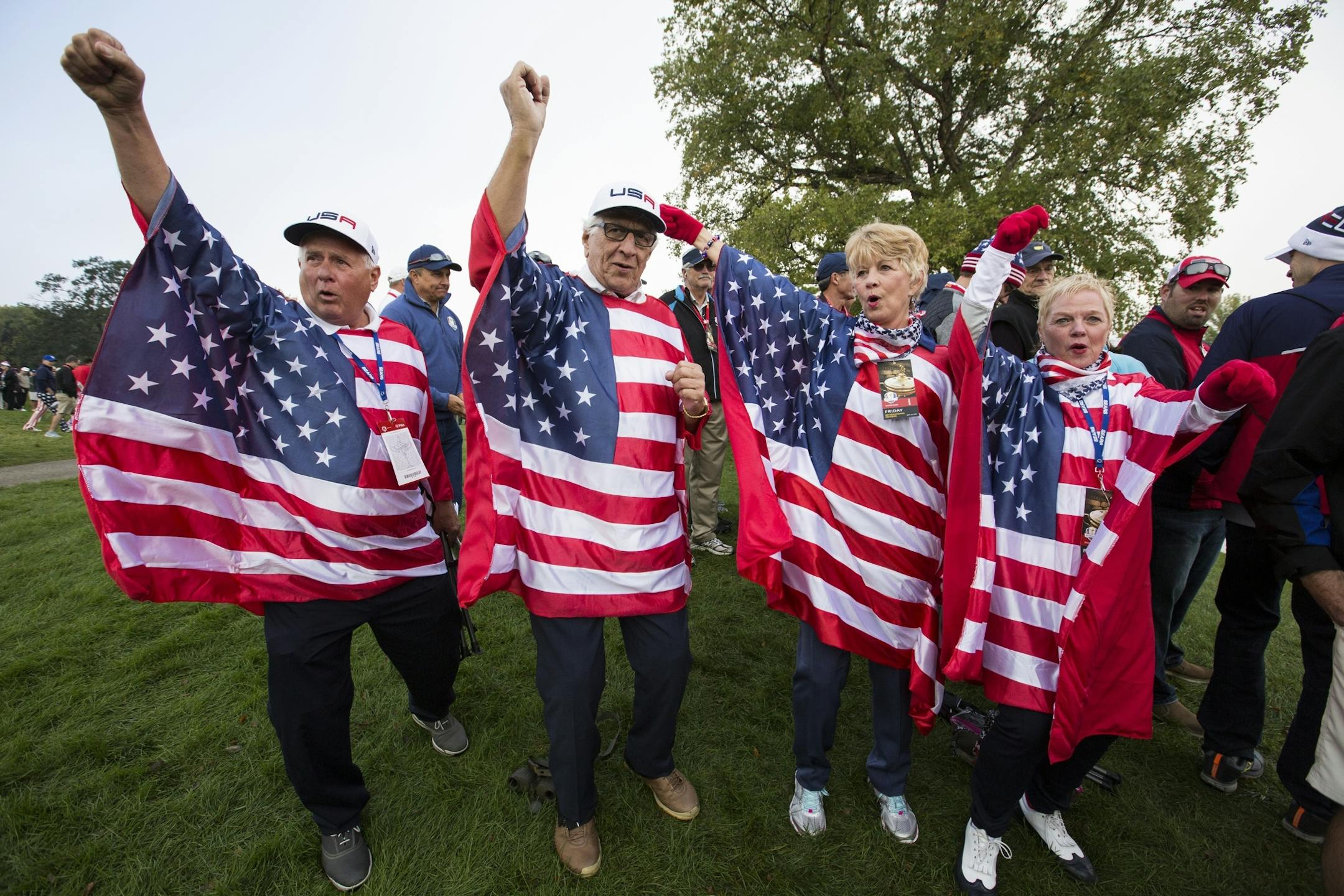 Sheila Applegate, from right, Evie Bain, Phil Follins and Dave Applegate from Aiken, South Carolina cheer for the USA.