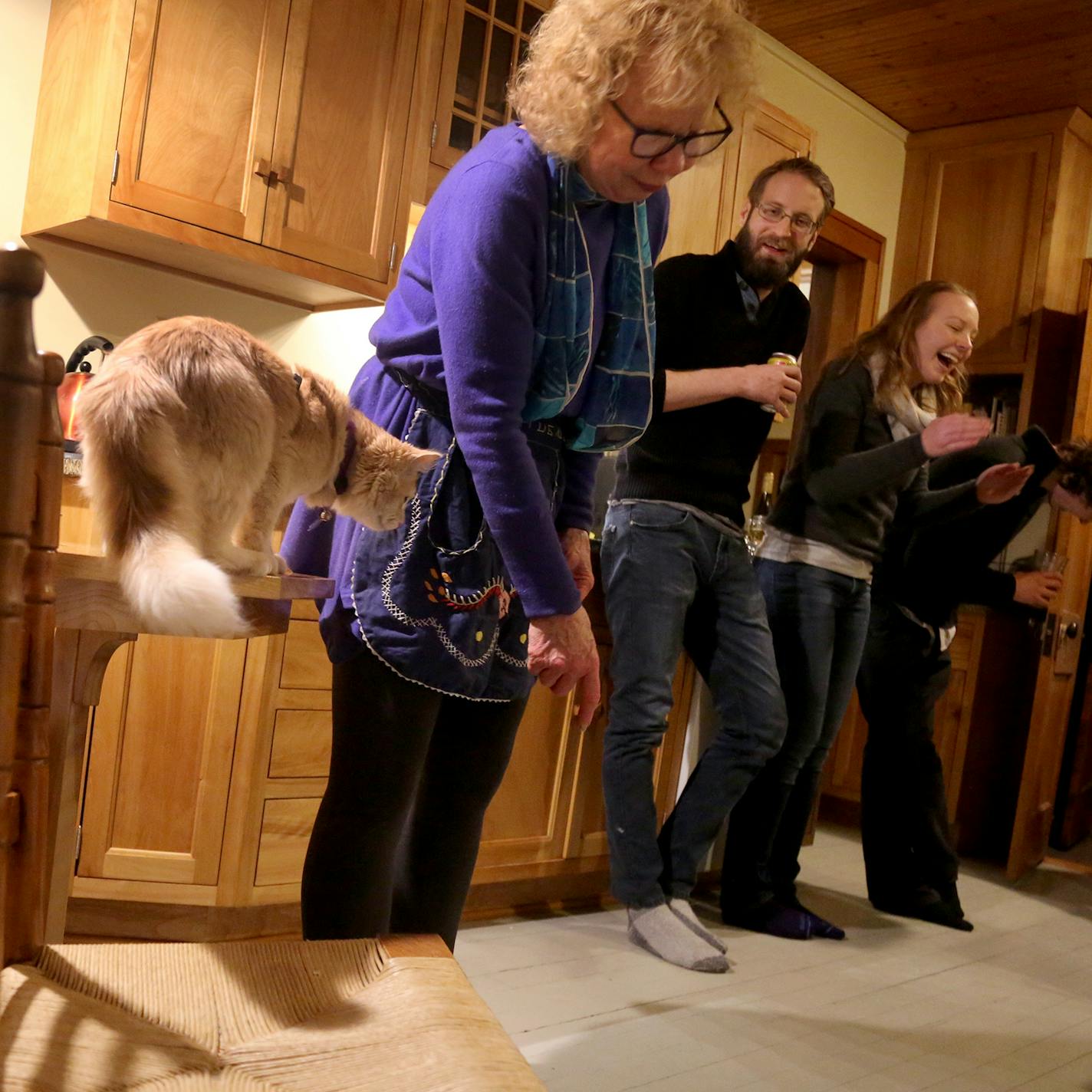 Two families, their children and occasionally friends have been dining together weekly for about 30 years. Here, Ann Luce tries to get the family cat to act like a dog but to no avail as dinner guests react.] DAVID JOLES &#xef; david.joles@startribune.com Two families have been dining weekly for 30 years, brought together by young children and continuing on through moments of celebration and sadness. While they now are gearing back on frequency, they have something to say about community, tradit