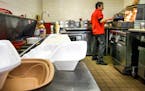Roberto Sanchez cooked up a falafel in the kitchen of Alimama's Mediterranean Grill, which now uses some Styrofoam boxes.