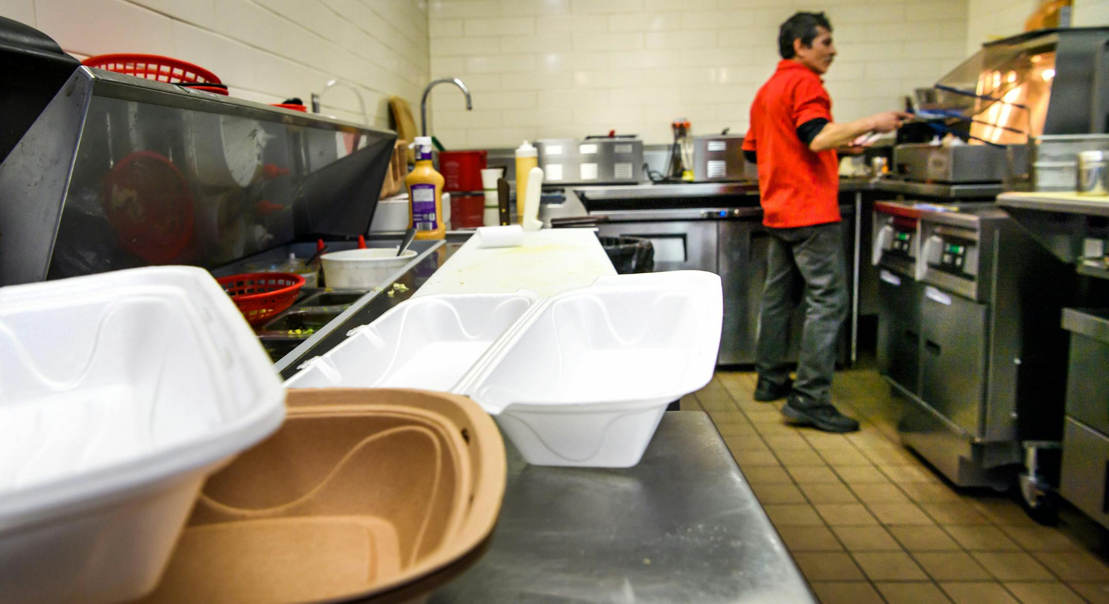 Roberto Sanchez cooked up a falafel in the kitchen of Alimama's Mediterranean Grill, which now uses some Styrofoam boxes.