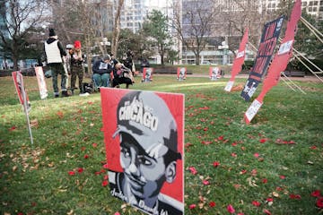 Activists with Visual Black Justice set up an art installation outside the Hennepin County Government Center as jury selection began in the trial of f