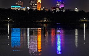 The Minneapolis skyline reflected in Lake Harriet.
