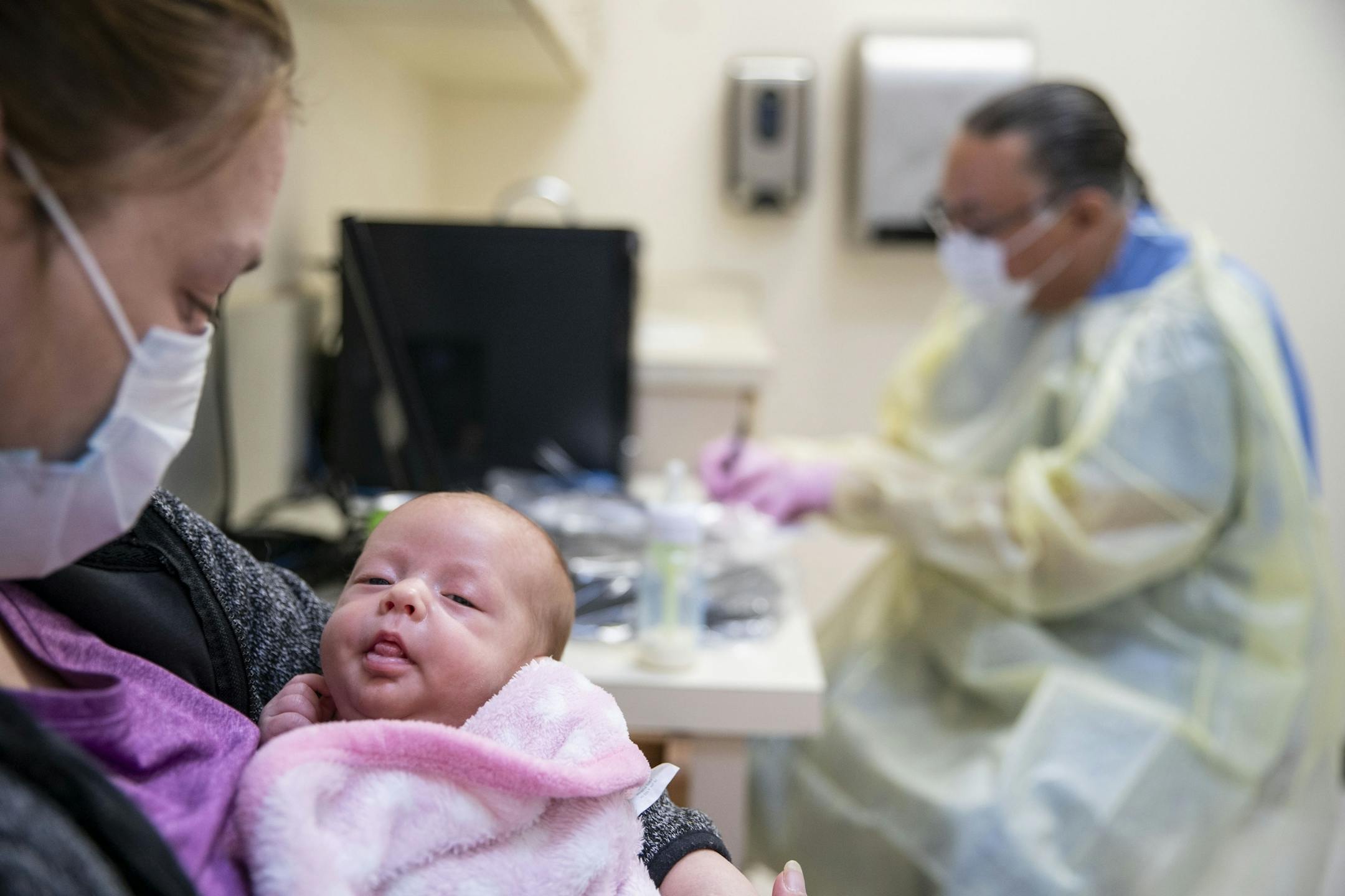 Cerri McKeon held her two-month-old daughter, Eden Smith while Dr. Vainio, MD took notes and he asked about her respiratory symptoms. Smith was tested for the flu, COVID-19 and RSV. The flu results came back negative and it will be a few days before the other results come back.