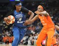 The Minnesota Lynx's Sylvia Fowles (34) drives on the Connecticut Sun's Jonquel Jones (35) during the first half Friday, Aug. 9, 2019, at Target Cente