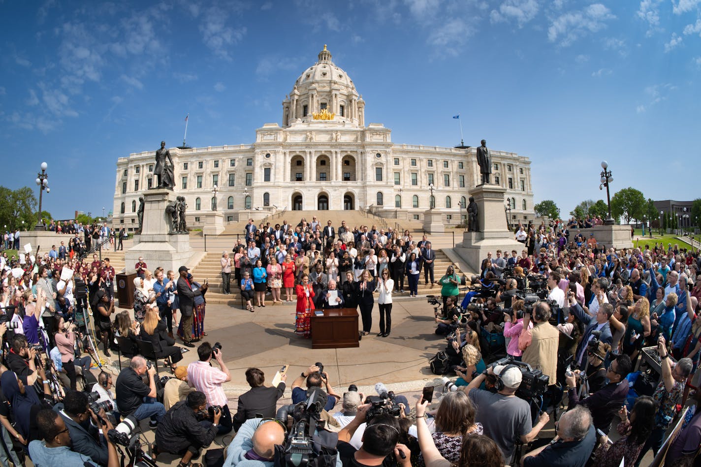 Along with DFL legislative leaders and his commissioners, Gov. Tim Walz threw a bill-signing party Wednesday morning on the Capitol steps in front of hundreds of supporters, a pep band at his side and a drone camera overhead recording the occasion. Wednesday, May 24, 2023  St. Paul, Minn.     ] GLEN STUBBE • glen.stubbe@startribune.com